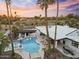 Aerial view of the backyard featuring a sparkling pool, covered seating area, and outdoor dining space at 6601 E Hearn Rd, Scottsdale, AZ 85254