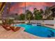 Inviting pool with lounge chairs and charming swan floatie, perfect for outdoor relaxation at 6601 E Hearn Rd, Scottsdale, AZ 85254