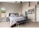 Well-lit bedroom featuring a king bed, bedside tables, and a cow print at 662 W Raven Dr, Chandler, AZ 85286