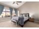 Serene bedroom with a pool view, curtains, and neutral colors at 662 W Raven Dr, Chandler, AZ 85286