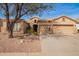 Charming home featuring a tile roof, three-car garage, and low-maintenance desert landscaping at 662 W Raven Dr, Chandler, AZ 85286