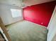 Simple and clean bedroom with carpeted floors, ceiling fan, and an accent wall at 6727 E Stacy St, Florence, AZ 85132