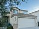 Two-story home showcasing a light-colored exterior, and a two-car garage at 6727 E Stacy St, Florence, AZ 85132