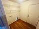 An inside view of the laundry room that offers shelving and a door for easy access to the home at 6727 E Stacy St, Florence, AZ 85132