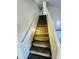 Carpeted staircase with white walls and handrail leads to the upper level of the home at 6727 E Stacy St, Florence, AZ 85132