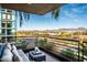 Inviting balcony seating area with city views, featuring a contemporary design and potted plants at 7180 E Kierland Blvd # 508, Scottsdale, AZ 85254