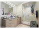 Modern bathroom featuring a glass-enclosed shower and a granite vanity at 7180 E Kierland Blvd # 508, Scottsdale, AZ 85254