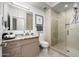 Modern bathroom featuring a glass-enclosed shower and a granite vanity at 7180 E Kierland Blvd # 508, Scottsdale, AZ 85254