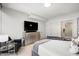 Comfortable bedroom featuring a neutral color palette, large dresser, and a television at 7180 E Kierland Blvd # 508, Scottsdale, AZ 85254