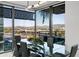 Chic dining area with a glass table, sleek chairs, and a picturesque city and mountain view at 7180 E Kierland Blvd # 508, Scottsdale, AZ 85254