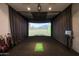 High-end golf simulator room with a large screen and all necessary equipment at 7180 E Kierland Blvd # 508, Scottsdale, AZ 85254