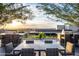 Outdoor kitchen with modern barbecue stations and dining tables offer city views at 7180 E Kierland Blvd # 508, Scottsdale, AZ 85254