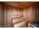 Beautiful in-home sauna with wood paneling, seating, and heating element at 7180 E Kierland Blvd # 508, Scottsdale, AZ 85254