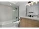 Modern bathroom featuring a shower-over-tub, sleek vanity, and contemporary fixtures at 7318 E Palo Verde Dr # 7, Scottsdale, AZ 85250