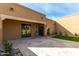 Covered patio with travertine flooring and landscaped yard at 7318 E Palo Verde Dr # 7, Scottsdale, AZ 85250