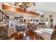 Open-concept living space connected to the kitchen, features wood floors and a fireplace at 8165 E Del Marino Dr, Scottsdale, AZ 85258