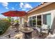 Outdoor patio featuring lounge furniture and dining seating around a fire pit with views of the backyard at 8165 E Del Marino Dr, Scottsdale, AZ 85258