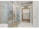 Bathroom with a glass-enclosed shower, tiled walls and a walk-in closet at 9467 E Rockwood Dr, Scottsdale, AZ 85255