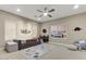 Cozy bedroom with a daybed, ceiling fan, and a window providing natural light at 9467 E Rockwood Dr, Scottsdale, AZ 85255