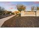 Legacy Cove community entrance with landscaping and a view of nearby mountain at 9467 E Rockwood Dr, Scottsdale, AZ 85255