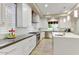 Bright kitchen with modern appliances, white cabinets, and a large center island with counter seating at 9467 E Rockwood Dr, Scottsdale, AZ 85255