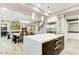 Spacious kitchen with stainless steel appliances, a center island, and an adjacent dining area at 9467 E Rockwood Dr, Scottsdale, AZ 85255