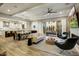 Open-concept living room featuring a modern design, wood floors, and seamless transition to the patio at 9467 E Rockwood Dr, Scottsdale, AZ 85255