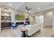 Modern living room with a fireplace, comfortable seating, and built-in shelving at 9467 E Rockwood Dr, Scottsdale, AZ 85255