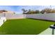 Lush green backyard with artificial turf at 951 N Poinciana Rd, Gilbert, AZ 85234