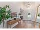 Beautiful foyer with hard wood floors, chandelier, and large mirror at 951 N Poinciana Rd, Gilbert, AZ 85234