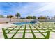 Beautiful in-ground pool with elegant landscaping and ample patio space at 951 N Poinciana Rd, Gilbert, AZ 85234