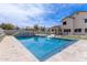 A luxurious in-ground pool with water feature and ample patio space at 951 N Poinciana Rd, Gilbert, AZ 85234