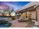 Beautiful backyard with a pool, spa, desert landscaping, lounge chairs, and sunset views at 10029 E Calle De Las Brisas --, Scottsdale, AZ 85255