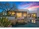 Inviting backyard with pool, spa, covered patio, lush greenery, and desert landscaping at 10029 E Calle De Las Brisas --, Scottsdale, AZ 85255