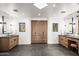 This large bathroom features duel sinks, ample cabinet storage, and dark marble floors at 10029 E Calle De Las Brisas --, Scottsdale, AZ 85255