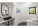 Unique bathroom with black vessel sink, granite countertop, arched doorway, and modern artwork at 10029 E Calle De Las Brisas --, Scottsdale, AZ 85255