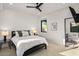 Serene bedroom with a black bed frame, side tables, and bright window at 10029 E Calle De Las Brisas --, Scottsdale, AZ 85255