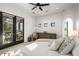 This bedroom features a king bed, doors to the patio, and is decorated with neutral colored décor at 10029 E Calle De Las Brisas --, Scottsdale, AZ 85255