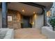 Close up of the entrance featuring a stone accent wall, a covered porch with dark wood pillars and flagstone pavers at 10029 E Calle De Las Brisas --, Scottsdale, AZ 85255