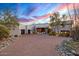 Stunning desert home featuring a paved driveway, a three-car garage, and desert landscaping at 10029 E Calle De Las Brisas --, Scottsdale, AZ 85255