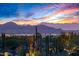 Expansive mountain view at sunset showcasing desert landscape, city lights, and towering cacti at 10029 E Calle De Las Brisas --, Scottsdale, AZ 85255