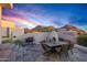 Charming outdoor dining area with seating for six, grill, desert landscape and mountain views at 10029 E Calle De Las Brisas --, Scottsdale, AZ 85255