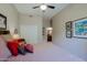 Bedroom featuring a bed, neutral-colored walls, ceiling fan, and closet at 10250 E Morning Star Dr, Scottsdale, AZ 85255