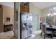 Bright eat-in kitchen with a large stainless steel fridge and inviting breakfast nook with windows at 10250 E Morning Star Dr, Scottsdale, AZ 85255