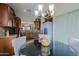 Breakfast nook features a dark wood table, stylish patterned chairs, and stainless steel appliances at 10250 E Morning Star Dr, Scottsdale, AZ 85255