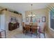 Dining room with seating for six, with a view into the kitchen at 10250 E Morning Star Dr, Scottsdale, AZ 85255