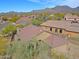 Charming single-story home featuring a well-manicured front yard and tile roof in a serene desert landscape at 10250 E Morning Star Dr, Scottsdale, AZ 85255