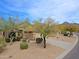 Charming single-story home featuring a well-manicured front yard and covered entryway at 10250 E Morning Star Dr, Scottsdale, AZ 85255