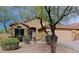Charming single-story home featuring a well-manicured front yard and covered entryway at 10250 E Morning Star Dr, Scottsdale, AZ 85255