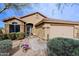 Charming single-story home featuring a well-manicured front yard and covered entryway at 10250 E Morning Star Dr, Scottsdale, AZ 85255